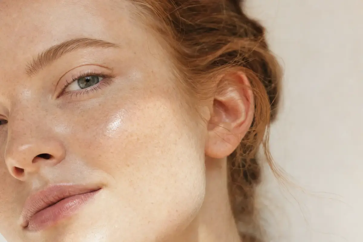 Close-up of a young woman with fair freckled Scottish skin